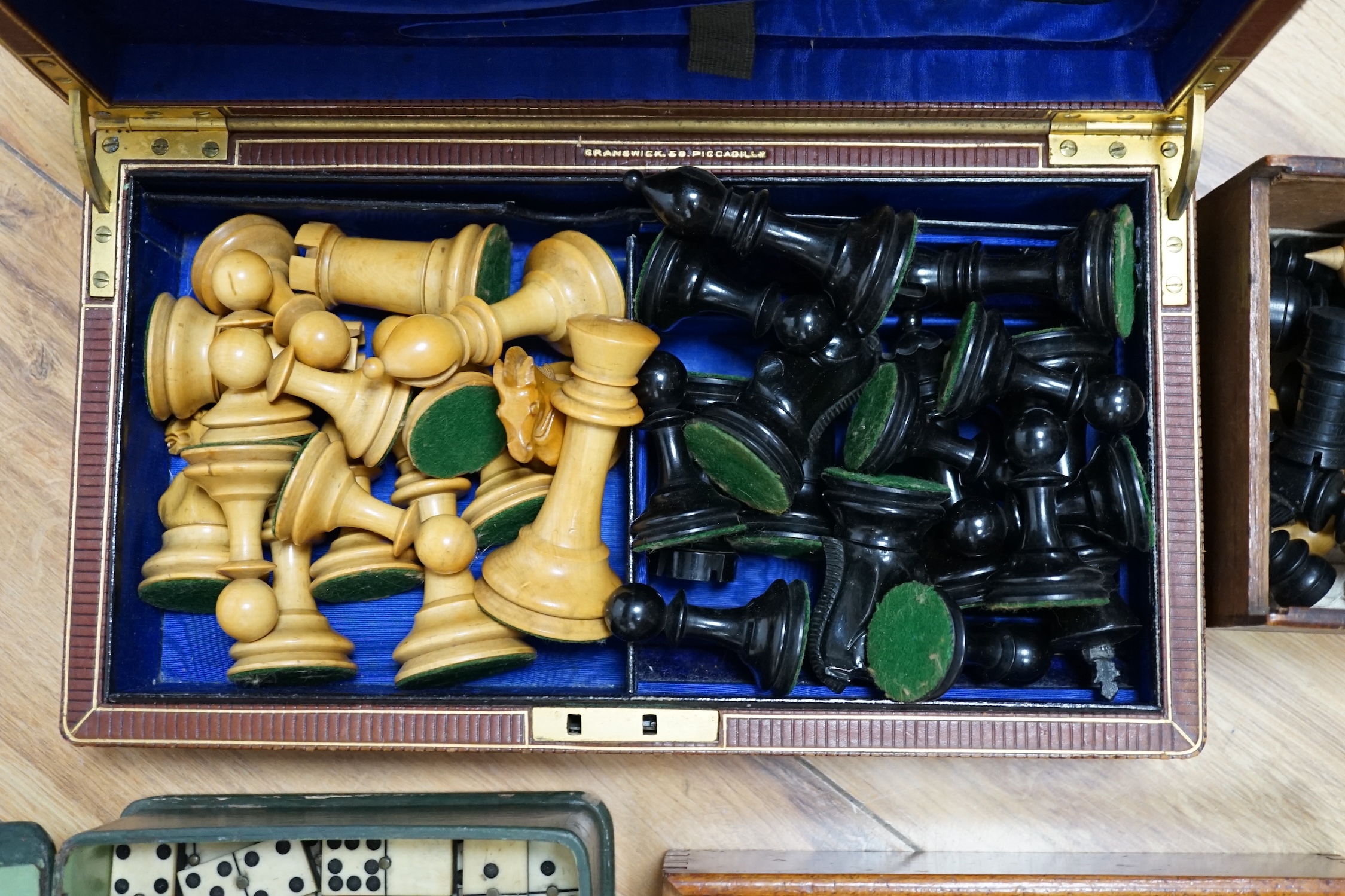 Three sets of dominoes and two chess sets, one Staunton pattern